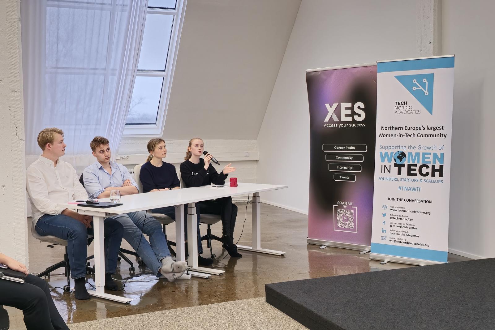 Four panellists seated at a table beside Tech Nordic Advocates and XES banners at the Antler Helsinki pitch events